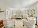Bright living room with stylish furniture, neutral tones, parquet floors, and natural light from large windows at 1325 Rock Point Rd, Charlotte, NC 28270
