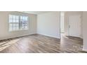 Bright living room features hardwood floors and lots of natural light at 1703 Wooten Way, Bessemer City, NC 28016