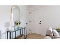 Bright entryway with console table, stylish mirror, and fresh flowers at 1757 Ashcroft Ln, Rock Hill, SC 29732