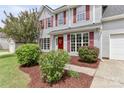 Inviting two-story home with red shutters, red door, and well-maintained landscaping at 183 Bellelaine Dr, Mooresville, NC 28115
