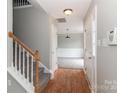 Bright entryway with hardwood floors, carpeted stairs, and neutral paint at 183 Bellelaine Dr, Mooresville, NC 28115