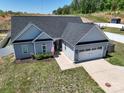 Charming single-Gathering home features a two-car garage, vinyl siding, and a well-manicured lawn at 2205 Philadelphia Church Rd, Dallas, NC 28034