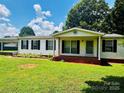 Charming single-story home with a well-maintained lawn and inviting front porch at 321 Jennings Rd, Statesville, NC 28625