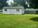 Exterior view of a white storage shed in the backyard at 321 Jennings Rd, Statesville, NC 28625