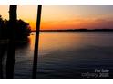 Picturesque sunset lake view, ideal for relaxation and enjoying nature's beauty at 372 Northwest Dr, Davidson, NC 28036