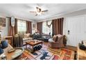 Relaxing living room with a ceiling fan, large rug, and a comfortable seating area with lots of natural light at 4705 Campground View Rd, Catawba, NC 28609