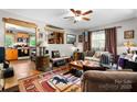 Cozy living room featuring a ceiling fan, comfortable seating, and an adjacent open kitchen at 4705 Campground View Rd, Catawba, NC 28609