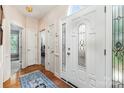 Inviting foyer featuring hardwood floors, decorative glass door, and arched transom window at 752 Pinebough Ln, Rock Hill, SC 29732