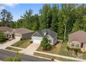 Beautiful suburban home with manicured lawns, surrounded by lush greenery, showcasing curb appeal and neighborhood charm at 7620 Porrera St, Charlotte, NC 28214