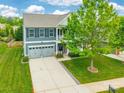 Two-story home with a two-car garage, lush lawn, and mature landscaping in quiet neighborhood at 9109 Loch Glen Way, Charlotte, NC 28278