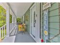 Inviting front porch featuring comfortable seating, decor, and a view of the surrounding greenery at 1009 Catawba Valley Se Blvd, Hickory, NC 28602