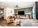 This cozy living room offers modern decor, comfortable seating, and a large television at 104 Trellis Ln, Troutman, NC 28166