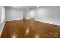 Spacious room featuring gleaming hardwood floors and a neutral color palette at 141 Edenvale Rd, Rock Hill, SC 29730