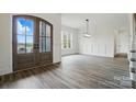 Bright and airy foyer with hardwood floors and craftsman style doors at 149 Shady Cove Rd, Troutman, NC 28166