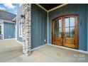 Elegant double front doors with glass panels and craftsman detailing at 149 Shady Cove Rd, Troutman, NC 28166