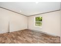 Bedroom view featuring flooring, window and natural light at 1785 Doe Ct, Iron Station, NC 28080