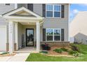 Inviting front entrance with a welcoming porch, decorative plants, and a stylish front door at 2772 Sherrills Stream Dr, Sherrills Ford, NC 28673