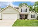 Charming two-story home with garage and manicured front lawn at 3032 Kilbeggan Dr, Clover, SC 29710