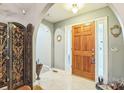 Elegant foyer with tile flooring, decorative screen and light-filled sidelights at 3585 Goodman Lake Rd, Salisbury, NC 28146