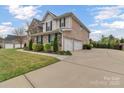 A spacious home with a three-car garage and a large driveway, situated on a well-manicured lot at 4071 Thames Cir, Fort Mill, SC 29715