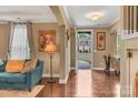 Inviting foyer with hardwood floors, neutral paint, and an open view to the exterior at 4071 Thames Cir, Fort Mill, SC 29715
