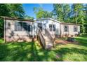 Inviting single-story home with wooden front porch stairs and a well-maintained lawn, perfect for outdoor relaxation at 4920 Morrison Houser Trl # 2, Lincolnton, NC 28092