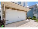 Spacious garage featuring a modern white door and stone accents at 507 Newfound Hollow Dr, Charlotte, NC 28214