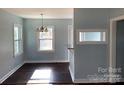 Bright dining room featuring hardwood floors and modern lighting fixtures at 523 Franklin Ave, Charlotte, NC 28206
