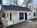 Cozy home featuring a fenced-in front yard and well-manicured landscaping at 523 Franklin Ave, Charlotte, NC 28206