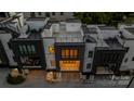 Aerial view of modern townhouses, highlighting rooftop decks, dark garage doors, balconies, and the property's layout at 614 Queens Rd, Charlotte, NC 28207