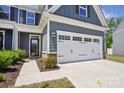 Attractive home exterior with an attached two-car garage and covered front entry at 6295 Ashton Park Dr, Denver, NC 28037