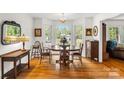 The dining room features natural light, wood floors, and a chandelier at 709 Weldon Ln, Salisbury, NC 28146
