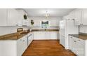 Bright kitchen features white cabinetry, granite countertops, and stainless steel appliances at 709 Weldon Ln, Salisbury, NC 28146
