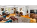 Cozy living room with hardwood floors, vintage furniture, and plenty of natural light at 709 Weldon Ln, Salisbury, NC 28146