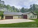 Spacious home with multiple garages and ample parking space in the backyard at 7358 Bay Cove Ct, Denver, NC 28037