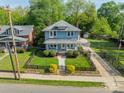 Lovely home with manicured lawn, fencing, mature trees, and a long driveway at 822 W Front St, Statesville, NC 28677