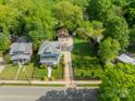 Aerial view of charming home with manicured lawn and private driveway at 822 W Front St, Statesville, NC 28677