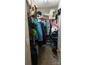 A walk-in closet provides plenty of storage space for clothing, shoes, and accessories at 8524 Stoneman Pl, Charlotte, NC 28217