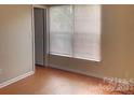 Cozy bedroom featuring durable floors, a bright window and ample natural light at 8551 Appledale Dr, Charlotte, NC 28262