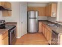 Efficient kitchen with stainless steel appliances, plentiful cabinet space, and durable countertops at 8551 Appledale Dr, Charlotte, NC 28262
