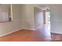 Inviting living area featuring durable flooring and neutral paint, leading to an outdoor space at 8551 Appledale Dr, Charlotte, NC 28262