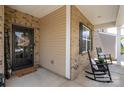 Charming entrance with rocking chairs on the porch, a 'Welcome' sign, and a clear view of the neighborhood at 9613 Fire Bellied Ct, Lancaster, SC 29720