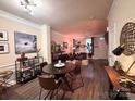 The spacious living room boasts hardwood floors and ample space for both dining and lounging at 9832 Longstone Ln, Charlotte, NC 28277