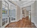 Elegant foyer with hardwood floors and decorative wainscoting, leading to various rooms at 128 Spears Creek Dr, Mooresville, NC 28117