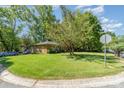 Traditional brick home with a large, well-maintained front lawn on a corner lot at 1301 Burnwick Ct, Charlotte, NC 28213