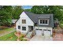 Charming two-story home with modern black trim and a two-car attached garage at 1816 Lisbon Ln, Charlotte, NC 28269
