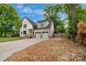 Charming two-story home with modern black trim and a two-car attached garage at 1816 Lisbon Ln, Charlotte, NC 28269