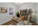 Modern home office with stylish desk, shelving, and a large window providing natural light at 1909 Summey Ave, Charlotte, NC 28205