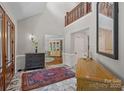 Grand foyer with marble floors, soaring ceilings, and elegant furnishings at 19501 River Falls Dr, Davidson, NC 28036