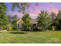 Charming home featuring a lush green lawn and well-maintained landscaping and traditional American architecture at 219 Reese Wilson Rd, Belmont, NC 28012